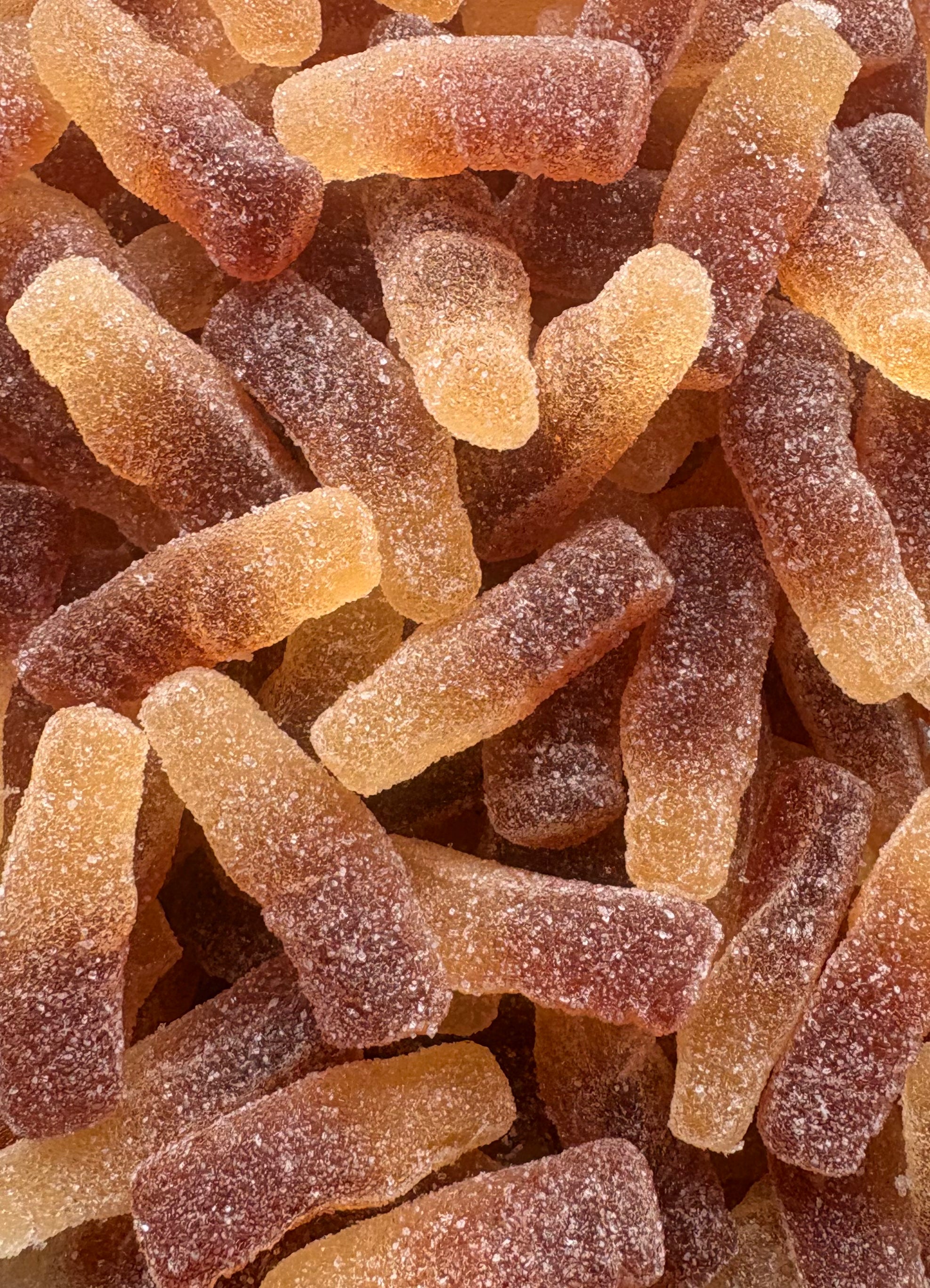 Bouteilles de Cola acidulées